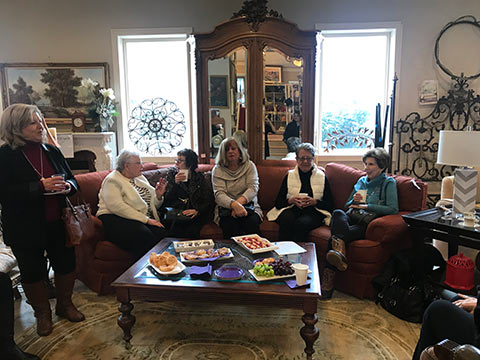 Ladies from the American Association of University Women meet at Design Consign to learn about how the consignment shop benefits victims of domestic violence.