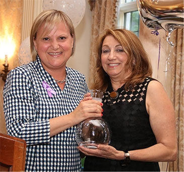 Board Chair Amy Wiwi (l) presents the Philanthropic Award to Karen Arakelian of The Gloria Foundation. 